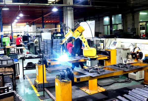 Automatic robotic arm production equipment in GP Metal Wares Dongguan factory, processing custom metal retail display rack components