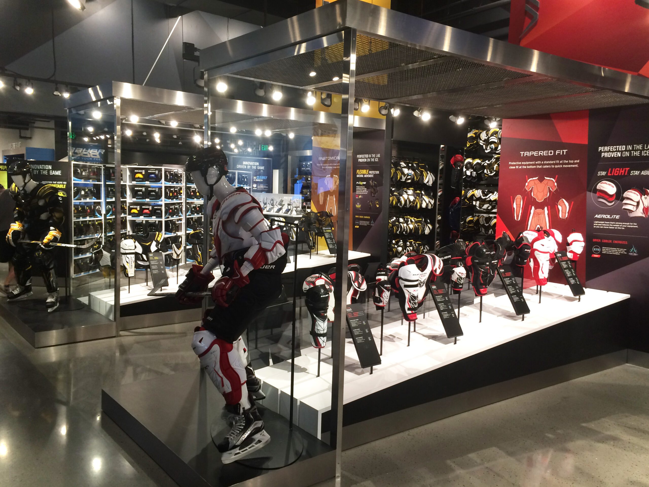 custom pos display manufacturer china for worldwide retail partners bespoke metal glass retail display stand for ice hockey sports equipment retail showroom merchandising